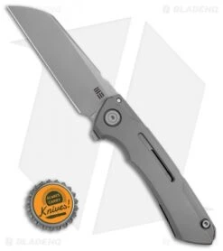 WE Knife Co. SNECX Mini Buster Flipper Knife Gray Titanium (3.5" Satin) -We Knife Co Shop WE Knife Co. SNECX Mini Buster Flipper Knife Gray Titanium 3.5in Satin 2003A BHQ 106955 LS Bottlecap